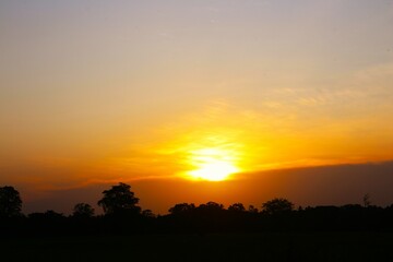 Sunset Sky Clouds in the evening with Red, Orange, Yellow and purple sunlight on Golden hour after sundown, Romantic sky in summer on Dusk Twilight. heart sky.