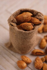 roasted almonds. Almonds are part of the Prunoidae subfamily of the Rosaceae family. This plant is in the same classification as peaches in the subgenus Amygdalus within Prunus. Prunus dulcis
