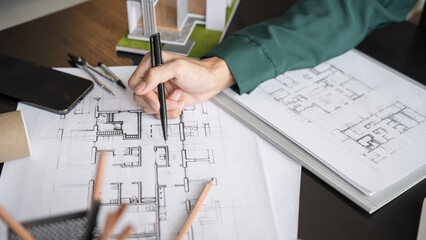 Architecture Man drawing on architectural Creative project business architecture building construction&nbsp;Industrial engineering Achievement Planning Design on eco blueprint