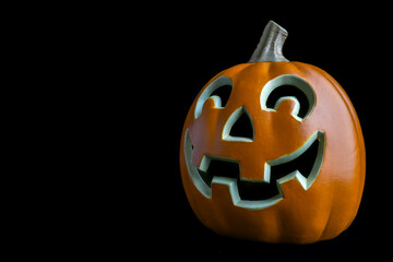 Carved Halloween pumpkin on a black background 