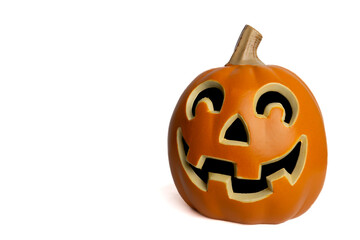 Carved halloween pumpkin with smiling face against a white background 