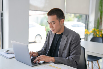 Business man working using laptop computer Hands typing keyboard. Professional investor working start up project. business planning in office. Technology business