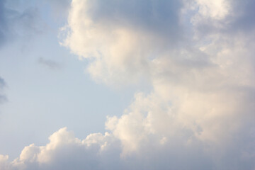 It's a blue sky with atmospheric puffy clouds