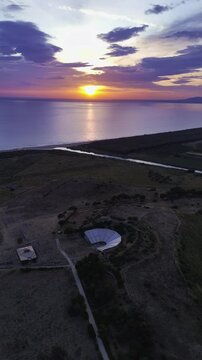 Evening flight over Sicily's enchanting coastlines, where mountains meet the sunset-lit sea. Heraclea Minoa. Sunset drone view, Sicily, Italy. 