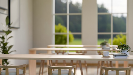 A copy space on a wooden tabletop in a comfortable, minimalist shared reading room or library.