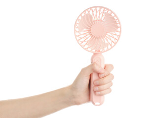 Mini electric pink fan with handle, isolated on white background. Portable electrical equipment that very useful when hot weather © stas_malyarevsky