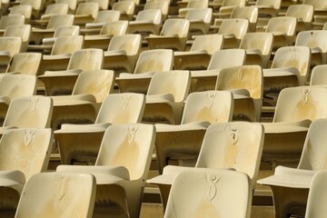 Empty stands and seats for fans and fans in the open-air stadium. Lack of fans during the pandemic.. Beautiful simple AI generated image in 4K, unique.