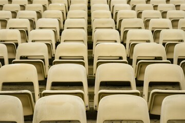 Naklejka premium Empty stands and seats for fans and fans in the open-air stadium. Lack of fans during the pandemic.. Beautiful simple AI generated image in 4K, unique.