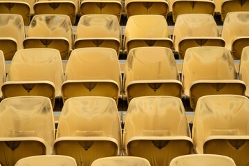 Naklejka premium Empty stands and seats for fans and fans in the open-air stadium. Lack of fans during the pandemic.. Beautiful simple AI generated image in 4K, unique.