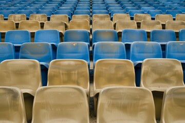 Fototapeta premium Empty stands and seats for fans and fans in the open-air stadium. Lack of fans during the pandemic.. Beautiful simple AI generated image in 4K, unique.
