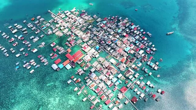 Aerial view of traditional stilt houses of bajo tribe on the water in  Wakatobi, Southeast Sulawesi, Indonesia