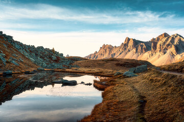 Landscape of Lac Long with Massif Des Cerces reflection during autumn in Claree valley at France
