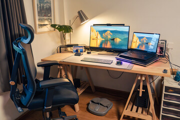 Interior workplace with laptop, monitor, computer device, lighting lamp, green leaf on wooden table and ergonomic chair
