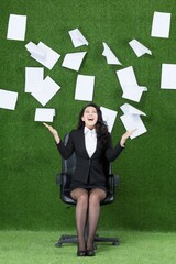 Ms grass business paper thrown into the air
