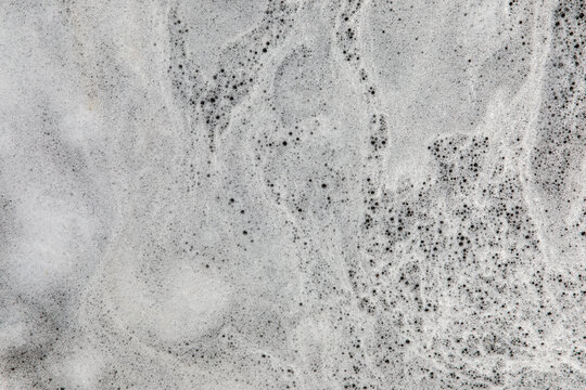 Environmental Hazard Background Texture: Toxic PFOS and PFAS Firefighting Foam Contaminates City Street