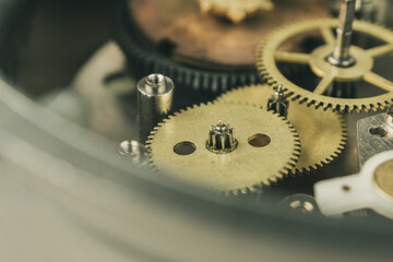 Close-up of a mechanical mechanism with gears, symbolizing watch repair and complex micromechanics