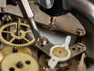 Close-up of a mechanical mechanism with gears, symbolizing watch repair and complex micromechanics