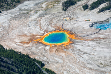 Obraz premium Areal shot of the Grand Prismatic Spring in Yellowstone national park shot out of an Aircraft showing the full range of beautiful colors.