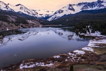 Trout Lake and snowy mountains at sunset, near Lizard Head Pass, Colorado, United States of America.