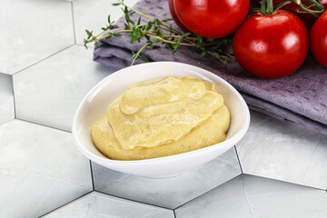 Dijon mustard sauce in the bowl