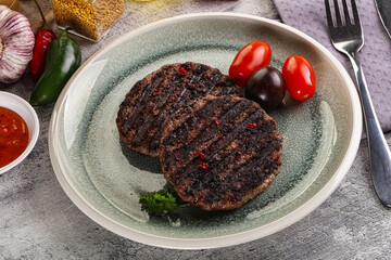 Grilled burger cutlet with sauce
