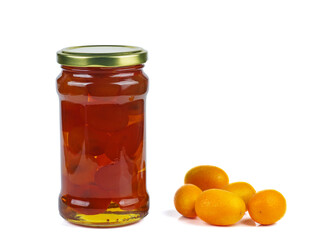 Cumquat or kumquat jam in glass jare and fresh berries isolated on white background