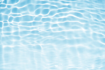Blue water with ripples on the surface. Defocus blurred transparent blue colored clear calm water...