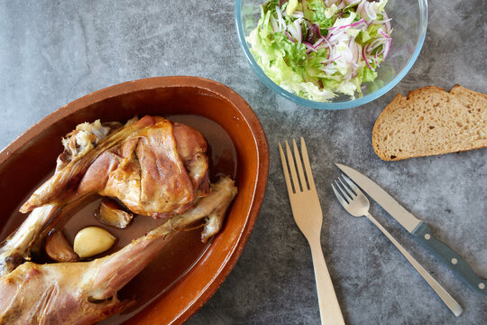 Top view of roast lamb and lettuce salad