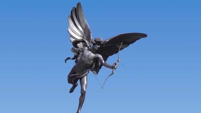 angel statue with wings and bow, cupid