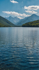 Obraz premium Lake with mountains against blue sky 