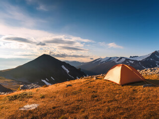 Photo of a tent in the mountain