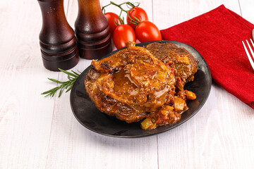 Italian cuisine - ossobuco with sauce