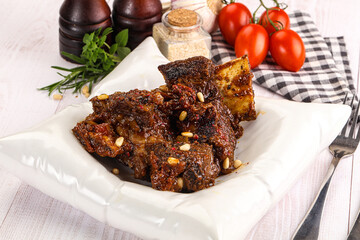 Prepared tasty beef ribs with sauce
