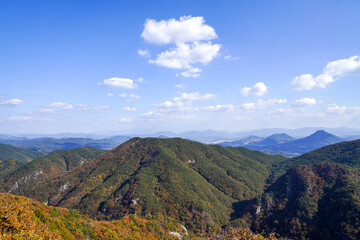 High angle and autumnal view of maple trees with ridge and peak of Gangcheon Mountain at Cheonggye-ri near Sunchang-gun, South Korea
