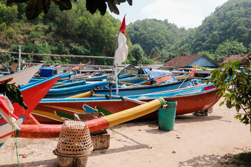 Fishing boats on the shore of Ngrenehan Beach, Gunung Kidul