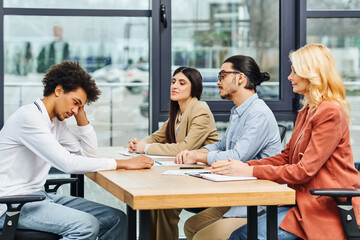 Job seekers in interview at office table