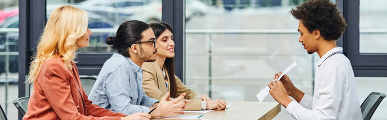 A diverse group of professionals engaging in a productive meeting in a modern office setting.