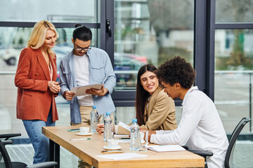 Job seekers engaging in a group discussion during a job interview at an office table.