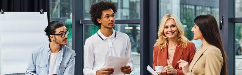 A diverse group of job seekers stand in front of a window, preparing for interviews.
