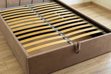 Bed with storage space. Wooden slats on the bed