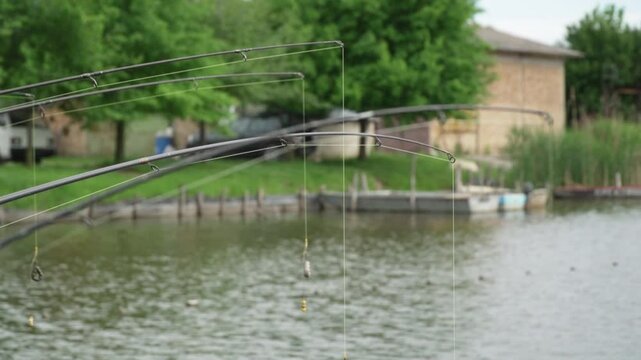 Close up view of fishing rods with sinkers tied to lines