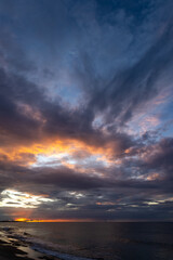 Incredible golden ocean sunset on tropical beach. vertical view