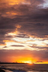 Incredible golden ocean sunset on tropical beach. vertical view