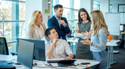 Group of employees discussing content and new project at office.