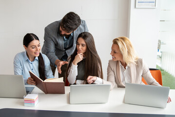 Business people working together on new project in modern office. Teamwork concept