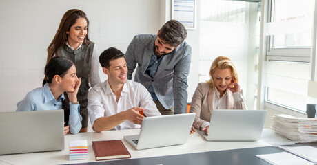 Business people working together on new project in modern office.