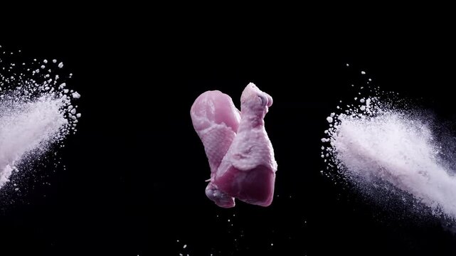 Chicken drumsticks flying in the air . Super Slow-motion 1000fps