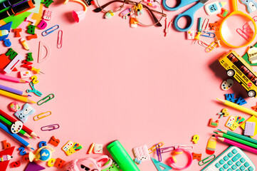 School supplies on pink background, used for Back to School advertising.