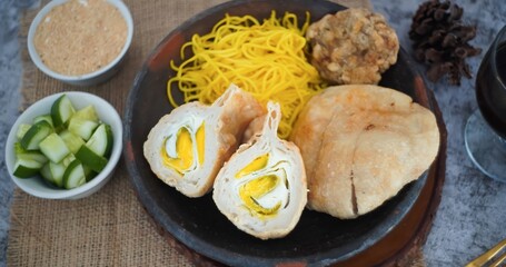 Pempek or mpek-mpek is a delicacy from Palembang, South Sumatra. It is made of fish and sago flours and served together with a dark, rich sauce called cuko.