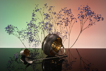 Still life - spoon, strainer and bowl on branch background